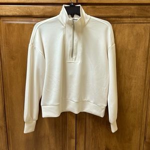 Off-white half zip pull over